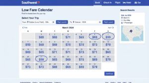Southwest Airlines Low Fare Calendar displayed on a laptop beside a boarding pass and travel map